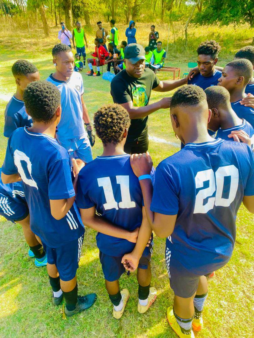 The Boys U19 squad in a pre-match huddle