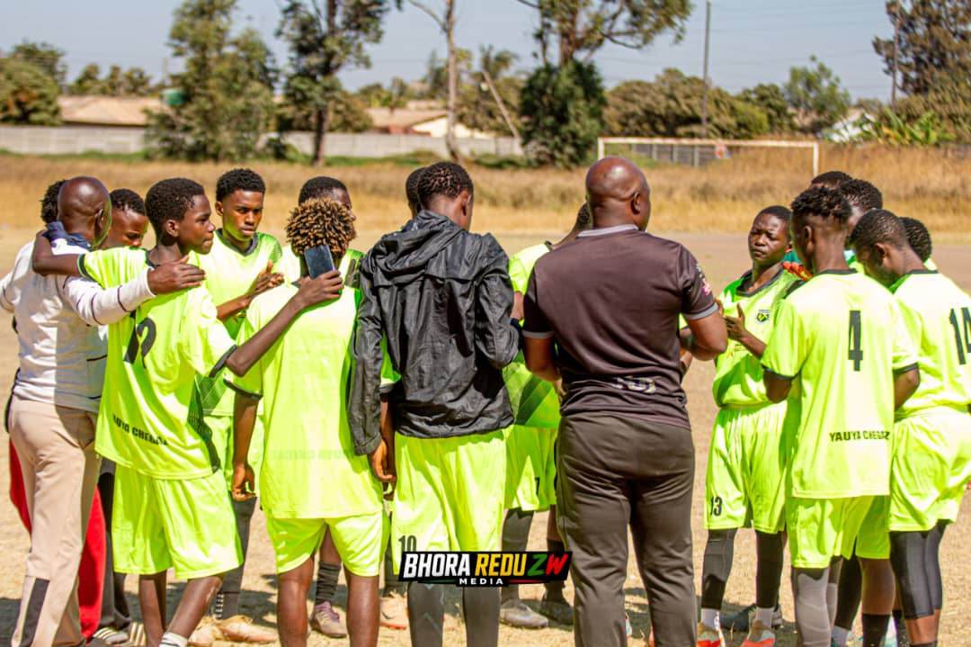 A coach addressing the Boys U19 squad before kick-off
