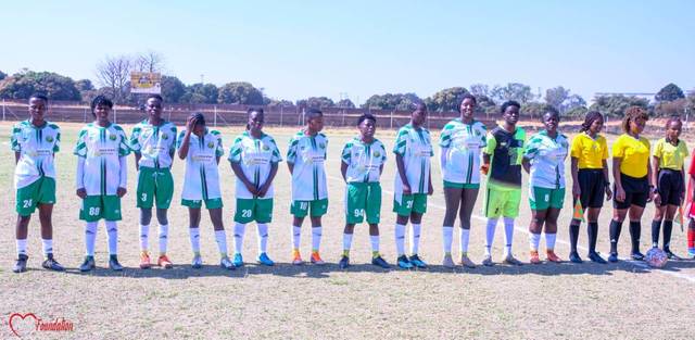 The team lined up with match officials